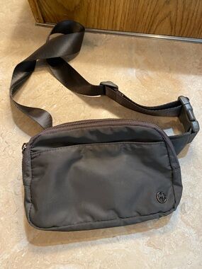Compact Black Crossbody Belt Bag with Subtle Logo